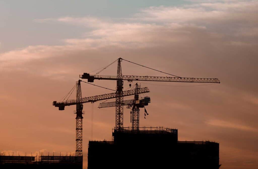 Cranes working at sunset