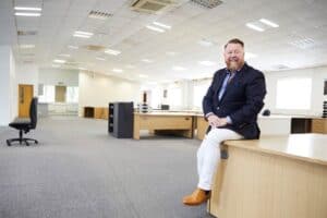 Jason Dixon, CEO of Docutech, in new Dukinfield office
